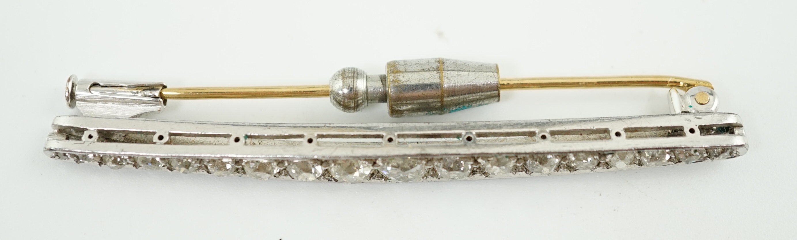 An early to mid 20th century platinum and graduated eighteen stone diamond set bar brooch